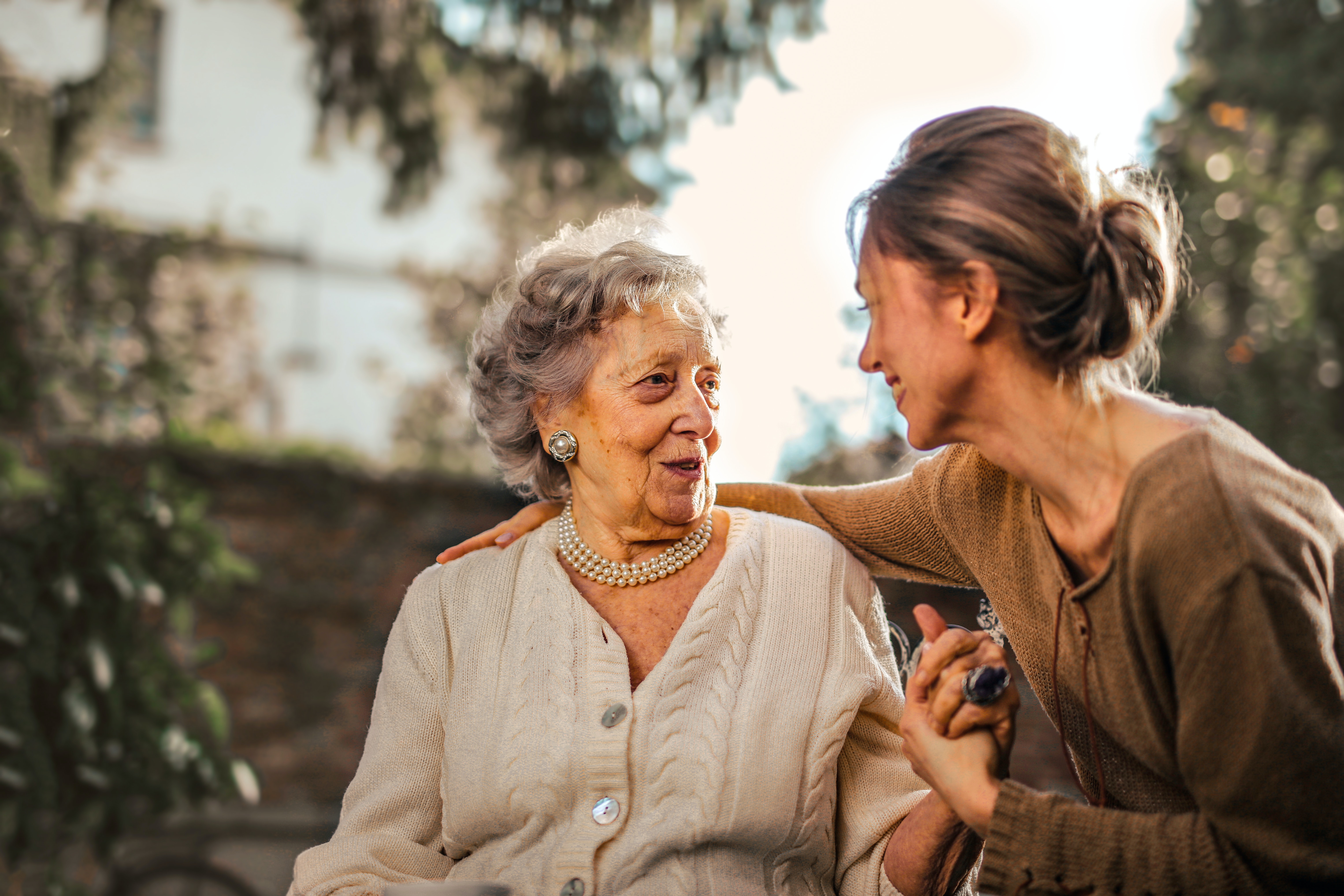 An older woman talks to a younger woman
