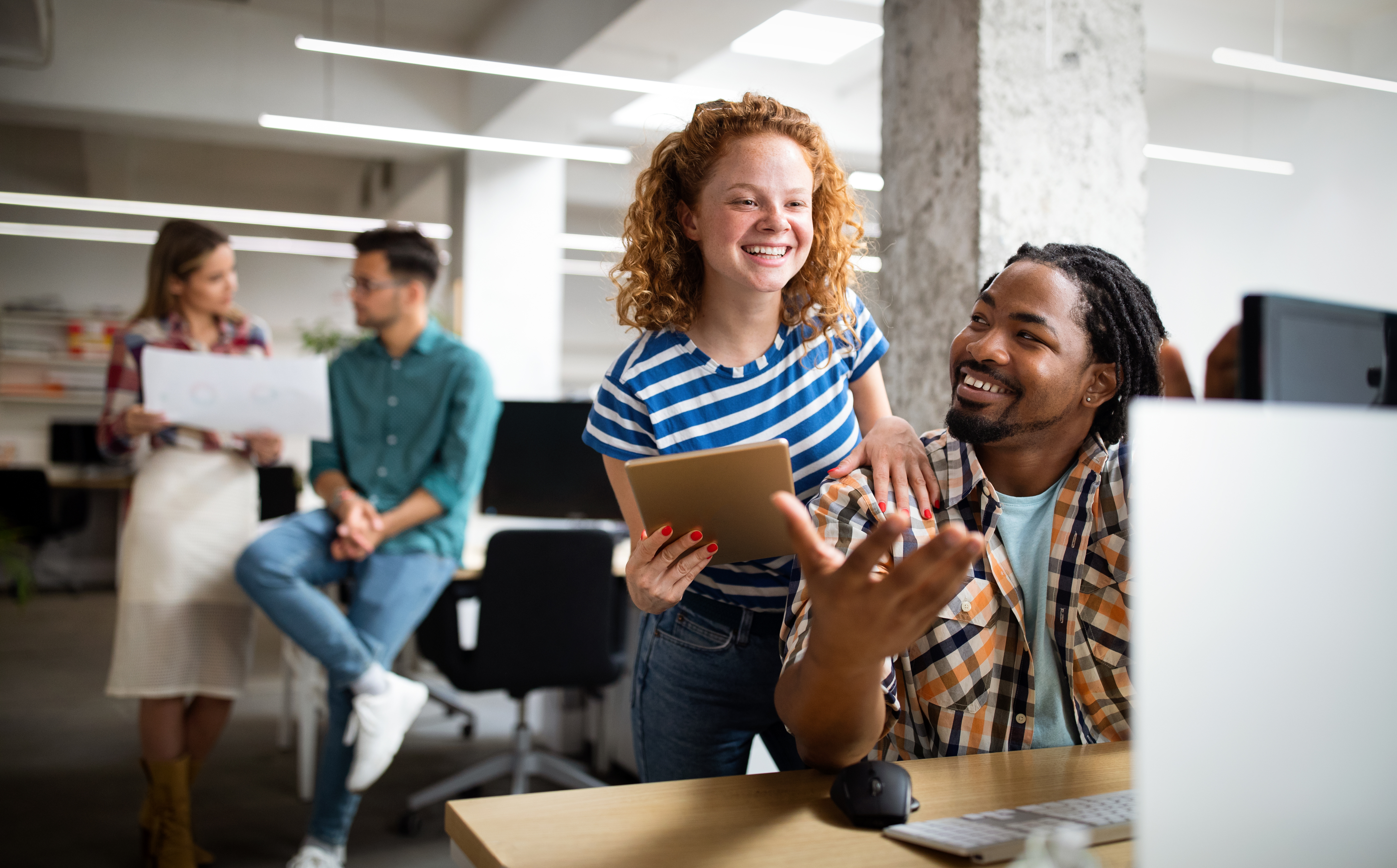 Business people having fun and chatting at workplace office