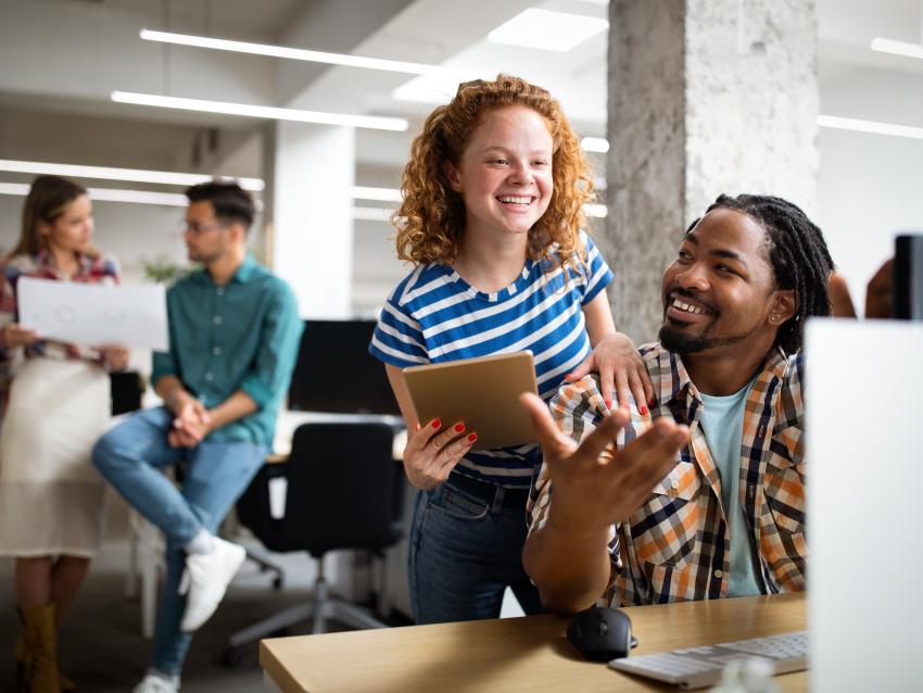 Business people having fun and chatting at workplace office