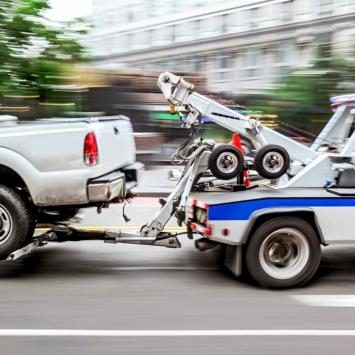 Tow truck towing a vehicle
